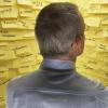 Product owner standing in front of a wall of sticky notes