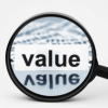 Magnifying glass zooming in on the word "value"