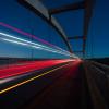 Time lapse of cars driving over a bridge, photo by Anders Jildén