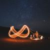 Person creating a "continuous" infinity sign with a sparkler